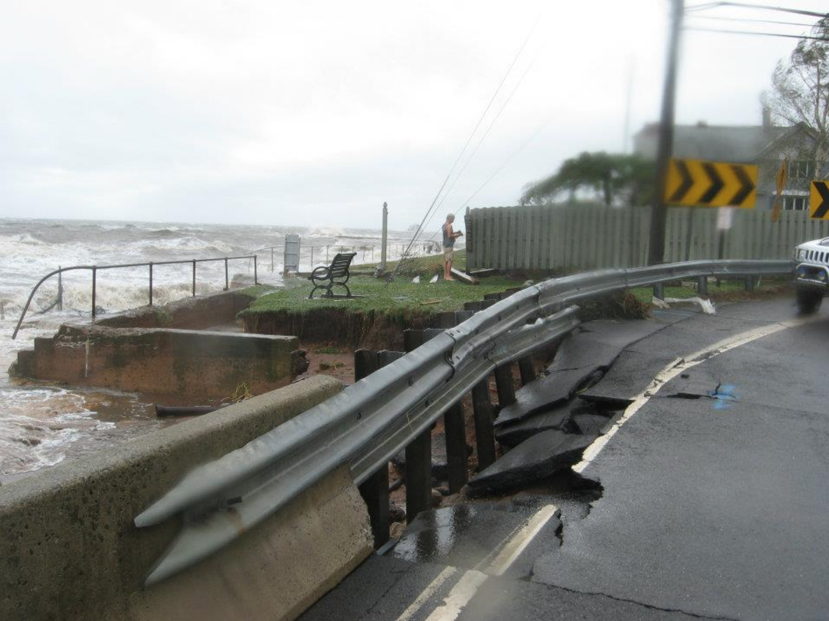 Route 146 is undermined, with large pieces of asphalt broken and falling into the sea.